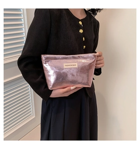 Close-up of pink metallic cosmetic bag with a Fashion Bag label and secure zipper