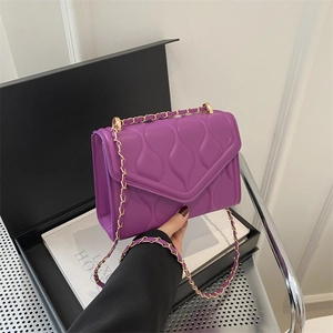Fashionable purple quilted crossbody bag with golden chain strap and magnetic flap