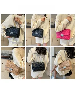 Detail view of quilted chain bags in black, rose, and beige with metallic turn-lock clasps