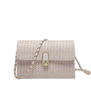 Beige woven crossbody bag with gold metallic twist lock and elegant chain shoulder strap