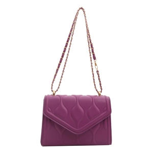 Deep purple quilted chain shoulder bag with gold hardware and wave stitching