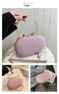 Pink glitter evening clutch with golden ring handle and bow clasp on a VOGUE magazine