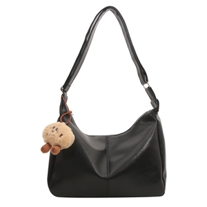 Minimalist black PU leather half-moon tote bag with a cute plush charm pendant