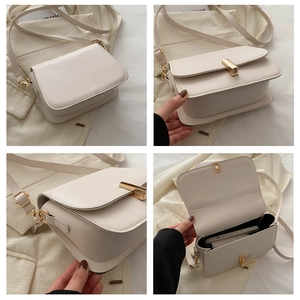 Detail view of cream flap bag with gold rectangle lock and minimalist interior