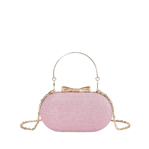 Pink glitter oval evening bag with gold handle and bow clasp for weddings and parties