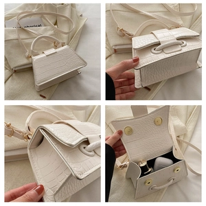 Detailed views of a white crocodile embossed mini crossbody bag with magnetic closure