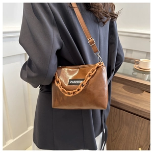 Brown PU leather crossbody bag with chic plastic chain and adjustable shoulder strap