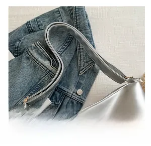 Detail of silver tote bag showing metallic PU texture and Fashion Bag label logo