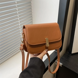 Retro brown PU leather crossbody bag with adjustable strap and gold metal buckle