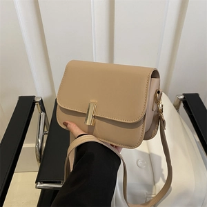 Minimalist beige rectangular crossbody bag with a smooth leather finish and gold buckle
