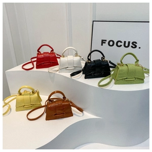 Detailed display of six colorful crocodile pattern mini handbags with top handles and straps