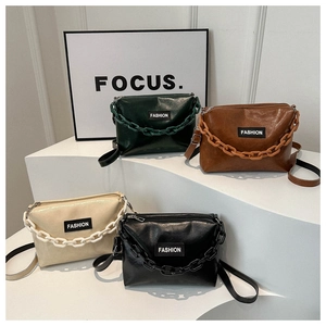 Minimalist faux leather crossbody bags with plastic chains in four classic colors