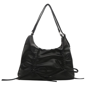 Large black drawstring backpack with pleats and decorative ribbon bows for fashion