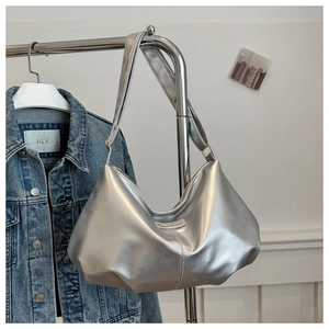 Detailed close-up of the silver metallic Hobo bag with Fashion & Bag logo tag