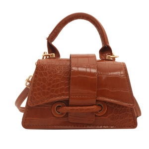 Brown crocodile embossed leather handbag with top handle and gold hardware in front view