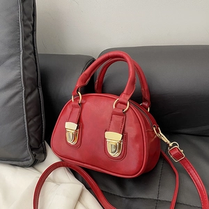 Retro red oil wax leather Boston bag with gold buckles and detachable crossbody strap
