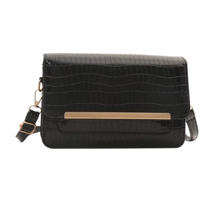 Chic black crocodile pattern crossbody flap bag with gold metal trim and adjustable strap