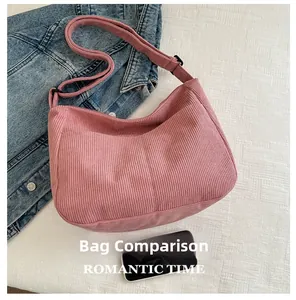Pink corduroy crossbody tote bag detail with smartphone size comparison