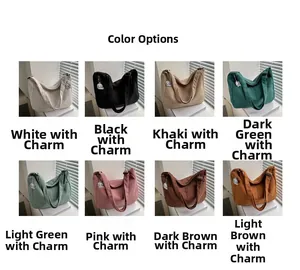 Corduroy tote bag detail showing eight available colors with cute cartoon pendants