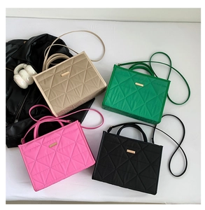 Quilted nylon tote bags in beige, green, pink, and black colors with gold metal plaque