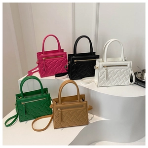 Chic woven texture small square handbags in five colors displayed on a modern podium