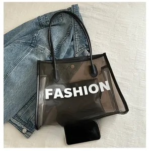 Detailed top view of black transparent PVC tote bag with internal pouch and size reference