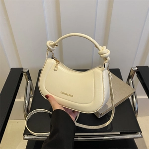 Chic beige half-moon shoulder bag with knot handle and detachable gold chain strap