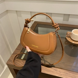 Elegant brown crescent handbag in synthetic leather with unique knotted handle detail