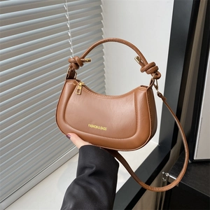 Caramel brown vintage small square handbag with knotted handle and golden hardware