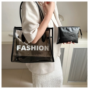Detail of transparent PVC tote bag with inner leather pouch and fashion print