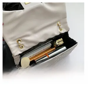 Quilted crossbody bag interior showing storage for phone, lipstick, and makeup compact