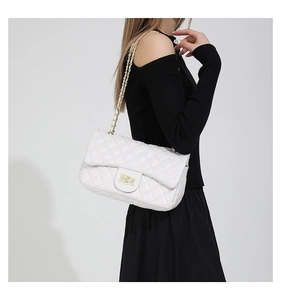 Classic white quilted shoulder bag with gold metal chain strap and twist-lock closure detail