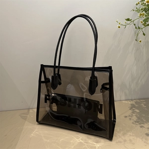 Stylish transparent PVC tote bag with black trim and inner pouch for summer fashion