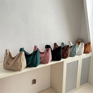 Corduroy large tote bag collection in multiple colors on minimalist display