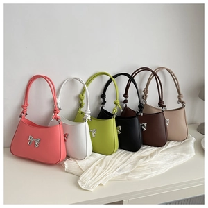 Group shot of hobo bags with knot straps and silver metal bows in six different colors