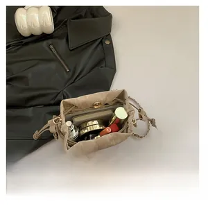 Interior view showing large capacity for smartphone and cosmetics in beige bucket bag