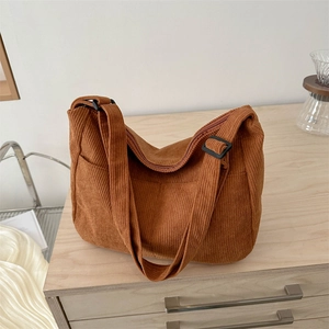 Brown corduroy tote bag for women featuring a spacious design and adjustable strap