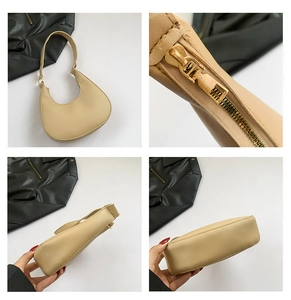 Détail d'un sac bandoulière en cuir PU crème montrant le zip doré et la construction latérale