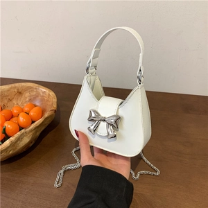 Chic white leather half-moon handbag with silver metal bow and chain strap for women