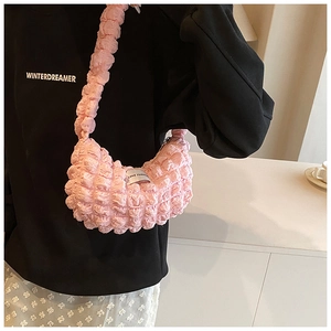 Detail of pink bubble textured hobo bag with Love Fashion tag on comfortable strap