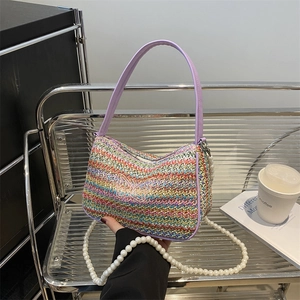 Colorful striped woven straw bag with butterfly embroidery and pearl strap detail