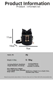 Detail view of mini black bucket bag showing dimensions 9x11x10cm and bow design