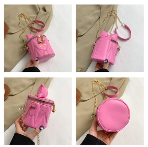 Detail view of pink bucket bag with cat ears, heart embroidery and chain strap