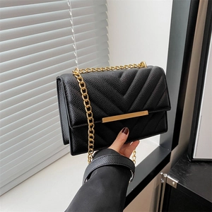Classic black V-quilted crossbody bag with gold chain strap and luxury leather texture