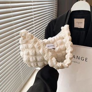 Chic cream bubble textured shoulder bag with minimalist cloud shape and puff fabric design
