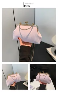 Pink satin evening clutch with golden chain strap and decorative clasp closure details