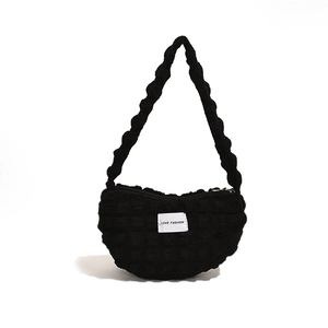 Fashionable black bubble textured shoulder bag with LOVE FASHION label and twisted handle