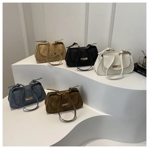 Retro saddle shoulder bags in khaki, black, white, and blue with metal buckles