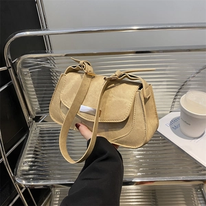 Minimalist khaki suede shoulder bag with adjustable strap and vintage flap design