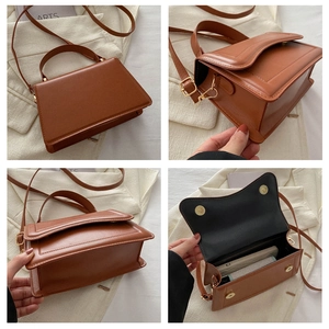 Detailed view of caramel brown crossbody bag showing stitching and golden magnetic hardware